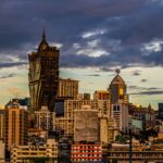 a view of a city with tall buildings under a cloudy sky