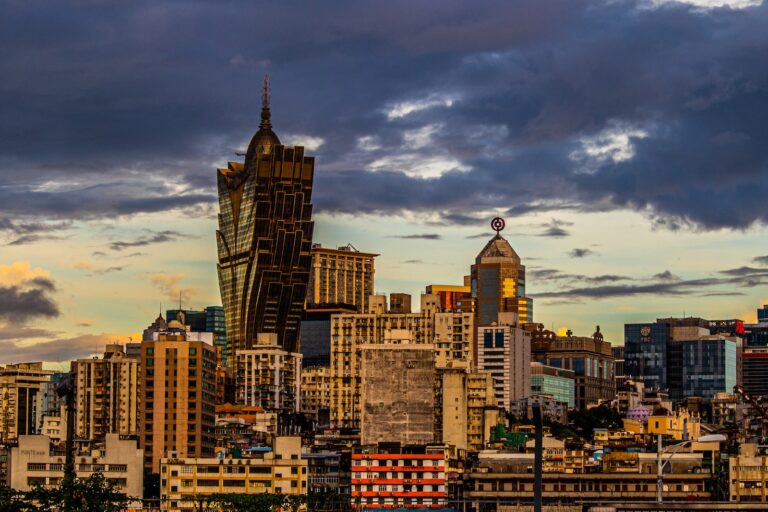 a view of a city with tall buildings under a cloudy sky